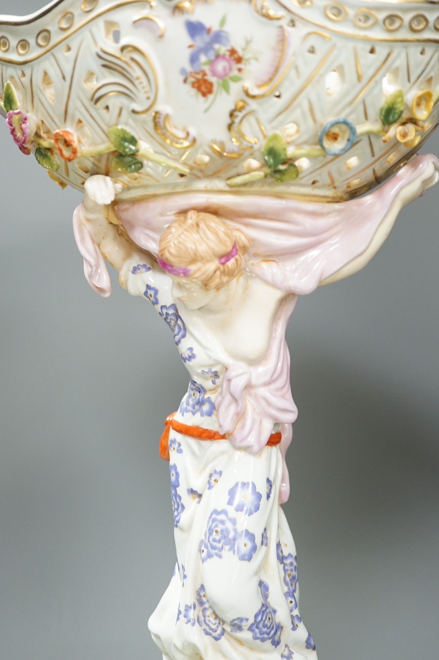 A German floral encrusted porcelain centrepiece and similar easel mirror, tallest 46cm